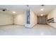 The three-car garage features epoxy flooring, custom decals, and ample space for vehicles and storage at 12547 W Stella Ln, Litchfield Park, AZ 85340