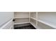 Pantry with lots of shelving and wood look floors at 12547 W Stella Ln, Litchfield Park, AZ 85340