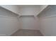 Spacious walk-in closet features ample shelving and rod space for organized storage at 12547 W Stella Ln, Litchfield Park, AZ 85340