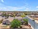 Beautiful neighborhood home with a manicured lawn, colorful landscaping, and a neighborhood view at 12630 W Corrine Dr, El Mirage, AZ 85335