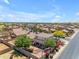 Charming suburban home featuring a well-manicured front yard, beautiful landscaping, and a cozy fire pit at 12630 W Corrine Dr, El Mirage, AZ 85335