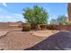Backyard with desert landscaping, gravel, and a bricked BBQ at 12630 W Corrine Dr, El Mirage, AZ 85335