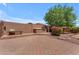 A backyard featuring a built-in grill, brick pavers, and a comfortable bench for outdoor relaxation at 12630 W Corrine Dr, El Mirage, AZ 85335