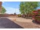 The backyard offers a unique layout with gravel areas and desert landscaping at 12630 W Corrine Dr, El Mirage, AZ 85335