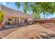 A backyard with an open space and a covered patio at 12630 W Corrine Dr, El Mirage, AZ 85335