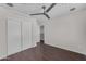 Bedroom featuring hardwood floors, a ceiling fan, and closet at 12630 W Corrine Dr, El Mirage, AZ 85335