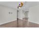 Bedroom with hardwood floors, ceiling fan, and mirrored closet doors at 12630 W Corrine Dr, El Mirage, AZ 85335