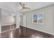 Spacious bedroom featuring dark wood floors and a mirrored closet at 12630 W Corrine Dr, El Mirage, AZ 85335
