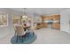 Charming dining area with a round table, adjacent to the kitchen, illuminated by natural light from nearby windows at 12630 W Corrine Dr, El Mirage, AZ 85335