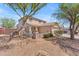 Charming two-story home featuring desert landscaping, a cozy front porch, and a classic tile roof at 12630 W Corrine Dr, El Mirage, AZ 85335