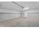 Clean, empty garage with gray walls and painted stripe at 12630 W Corrine Dr, El Mirage, AZ 85335