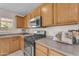 Close up of kitchen with wooden cabinets and modern appliances at 12630 W Corrine Dr, El Mirage, AZ 85335