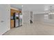 Open kitchen with stainless steel refrigerator and tile flooring at 12630 W Corrine Dr, El Mirage, AZ 85335