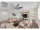 Relaxing living room with modern decor and large windows at 12630 W Corrine Dr, El Mirage, AZ 85335