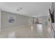 Open-concept living room with tile flooring, offering a spacious and flexible layout for various uses at 12630 W Corrine Dr, El Mirage, AZ 85335