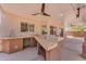 Outdoor kitchen with granite countertops and sink at 12630 W Corrine Dr, El Mirage, AZ 85335