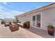 Outdoor patio with comfortable seating around a cozy fire pit at 12630 W Corrine Dr, El Mirage, AZ 85335