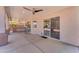 Covered patio with large sliding glass door and views of backyard at 12630 W Corrine Dr, El Mirage, AZ 85335