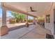 Large covered patio with ceiling fans, bar area, and spacious seating at 12630 W Corrine Dr, El Mirage, AZ 85335