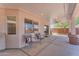 Relaxing patio area featuring seating and views of the backyard landscaping at 12630 W Corrine Dr, El Mirage, AZ 85335