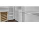 Organized walk-in closet featuring custom shelving and drawers at 12630 W Corrine Dr, El Mirage, AZ 85335