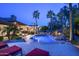Tranquil backyard with a shimmering pool, waterfall feature, and lounge chairs at 12820 N 83Rd Pl, Scottsdale, AZ 85260