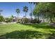 Spacious backyard with lush lawn, mature trees, and a pool area perfect for relaxing and entertaining guests at 12820 N 83Rd Pl, Scottsdale, AZ 85260