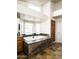 Luxurious bathroom features a standalone tub with marble surround, unique tile floor, and ample natural light at 12820 N 83Rd Pl, Scottsdale, AZ 85260