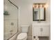 Bright bathroom featuring a shower, vanity, mirror and modern lighting at 12820 N 83Rd Pl, Scottsdale, AZ 85260