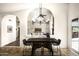 An open dining area featuring a dark wood table set adjacent to the inviting living room space at 12820 N 83Rd Pl, Scottsdale, AZ 85260