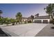 Charming single-story home with three-car garage, circular driveway, mature landscaping, and inviting curb appeal at 12820 N 83Rd Pl, Scottsdale, AZ 85260
