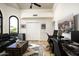 Home office area with dual workstations, leather couch, and a desert view at 12820 N 83Rd Pl, Scottsdale, AZ 85260