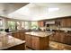 Spacious kitchen featuring granite countertops, a central island, and stainless steel appliances at 12820 N 83Rd Pl, Scottsdale, AZ 85260
