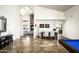 Spacious living area featuring travertine floors, arched doorways, and open floor plan at 12820 N 83Rd Pl, Scottsdale, AZ 85260