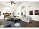 Bright living room featuring a fireplace, vaulted ceilings, and open floor plan at 12820 N 83Rd Pl, Scottsdale, AZ 85260