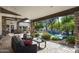 Covered outdoor patio with brick flooring, comfortable seating, and view of the pool at 12820 N 83Rd Pl, Scottsdale, AZ 85260