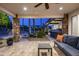 Inviting patio with brick flooring, cozy furniture, and a stunning view of the backyard and pool at 12820 N 83Rd Pl, Scottsdale, AZ 85260