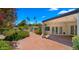 Lush landscaped backyard with brick pavers and string lights at 13007 N 1St St, Phoenix, AZ 85022