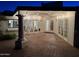 Outdoor patio with brick pavers and string lights at 13007 N 1St St, Phoenix, AZ 85022