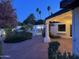 Charming backyard patio with brickwork, column, and string lights, perfect for relaxing evenings at 13007 N 1St St, Phoenix, AZ 85022