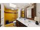Bright bathroom featuring a tile shower, double sinks, and a skylight at 13007 N 1St St, Phoenix, AZ 85022