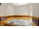 Bright bathroom features a soaking tub with decorative tile accents and a skylight at 13007 N 1St St, Phoenix, AZ 85022