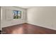 Bedroom with a neutral color palette and views of the surrounding trees at 13007 N 1St St, Phoenix, AZ 85022