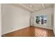 The bedroom has great light, classic shutters, and warm terracotta tile flooring at 13007 N 1St St, Phoenix, AZ 85022
