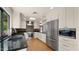 Modern kitchen with stainless steel appliances, custom cabinets, granite countertops and a beautiful window view at 13007 N 1St St, Phoenix, AZ 85022