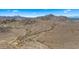 Expansive desert landscape with hiking trails featuring natural terrain and captivating views of mountains and distant city skylines at 13007 N 1St St, Phoenix, AZ 85022