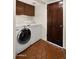 Convenient laundry room with modern appliances and a classic tile floor at 13007 N 1St St, Phoenix, AZ 85022