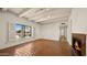 Bright living room with hexagon tile flooring, a fireplace, and shuttered windows at 13007 N 1St St, Phoenix, AZ 85022