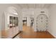 The spacious open floorplan features terracotta tile floors and custom-built wine storage at 13007 N 1St St, Phoenix, AZ 85022