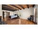 Inviting bedroom with wood floors, beamed ceilings, and French doors to the backyard at 13007 N 1St St, Phoenix, AZ 85022